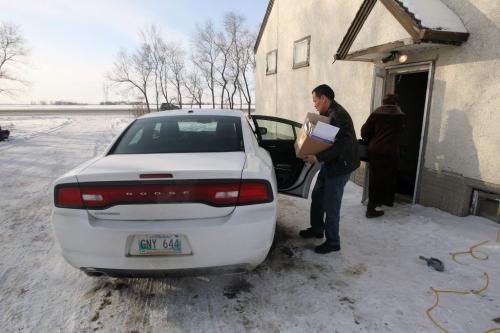 Chief Adrian Sinclair, Lake St. Martin gets in his rented car at his home on Kind Edward just north of 101 Hwy  He wanted to show all that he lives in a  a modest home- See Alex Paul story- February 14, 2013   (JOE BRYKSA / WINNIPEG FREE PRESS)