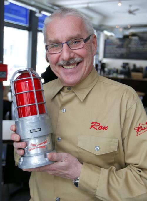 Ron Kovacs poses with a Budweiser Red Light at the FP Cafe. Feb 15, 2013  BORIS MINKEVICH / WINNIPEG FREE PRESS