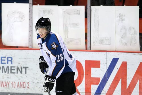 Brandon Sun Kootenay Ice's Landon Peel warms up prior to Friday evening's game with the Wheat Kings with a sign from his local fans.  (Colin Corneau/Brandon Sun)