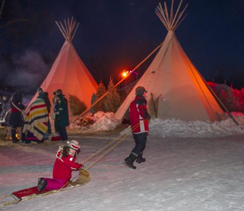 021513 Winnipeg-  A girl is pulled on a sled prior to the opening ceremony of the 44th edition of the Festival du Voyageur Friday night at Voyageur Park. DAVID LIPNOWSKI / WINNIPEG FREE PRESS