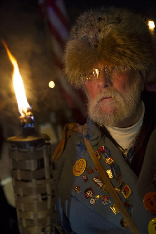 021513 Winnipeg-  George Einarson holds a torch prior to the opening ceremony of the 44th edition of the Festival du Voyageur Friday night at Voyageur Park. DAVID LIPNOWSKI / WINNIPEG FREE PRESS
