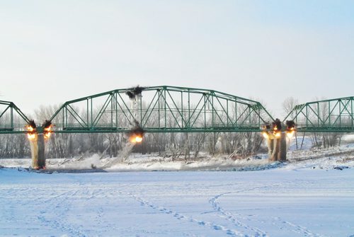 The St. Jean Baptiste bridge was demolished around 9 AM Saturday morning in front of a gathering of townspeople and local residents.  130216 February 16, 2013 Mike Deal / Winnipeg Free Press
