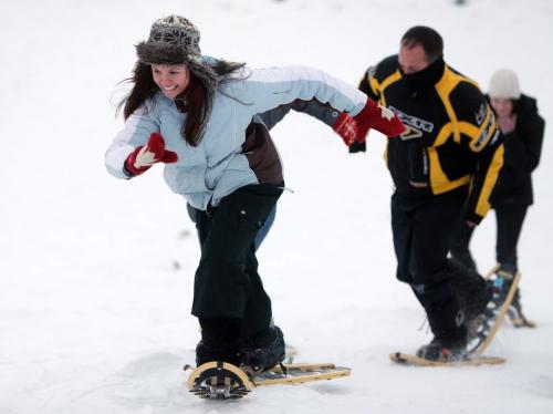 Kristy Hawes, 25, races up a hill on snowshoes at the Festival du Voyageur, Saturday, February 16, 2013. (TREVOR HAGAN/WINNIPEG FREE PRESS)
