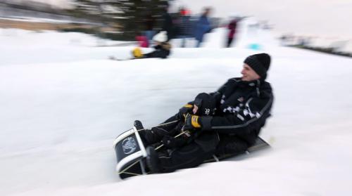 In the near lane, Caleb Gilis, 3 rides with his father,  Chad, as they race against his brother Mason, 4, and aunt, Trista, at the Festival du Voyageur, Saturday, February 16, 2013. (TREVOR HAGAN/WINNIPEG FREE PRESS)