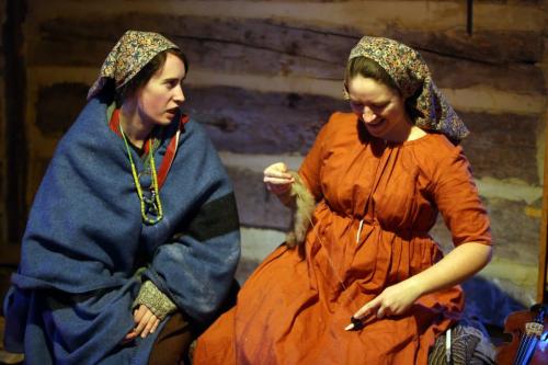 Erin Johnston-Weiss, 21, and Julia Gamble, 29, in one of the buildings inside Fort Gibraltar at the Festival du Voyageur, Saturday, February 16, 2013. (TREVOR HAGAN/WINNIPEG FREE PRESS)