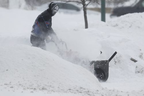 February 18, 2013 - 130218  -  Winnipeggers were out clearing snow after being hit by an Alberta Clipper overnight Monday February 18, 2013. John Woods / Winnipeg Free Press