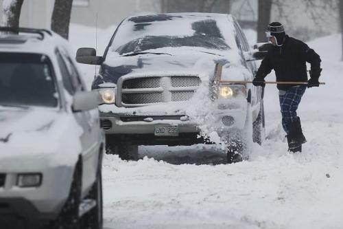 February 18, 2013 - 130218  -  Winnipeggers were out clearing snow after being hit by an Alberta Clipper overnight Monday February 18, 2013. John Woods / Winnipeg Free Press