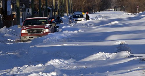Motorists were stuck in snow drifts Tuesday morning caused by blowing snow last weekend across Silver Ave. west of Inglewood St. in St. James.    (WAYNE GLOWACKI/WINNIPEG FREE PRESS) Feb. 19 2013