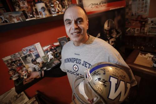 February 19, 2013 - 130219  -  Lorne Korol, chaplain for the Winnipeg Goldeyes, Bombers and Jets, is photographed in his basement with some of his sports paraphernalia Tuesday, February 19, 2013.  John Woods / Winnipeg Free Press