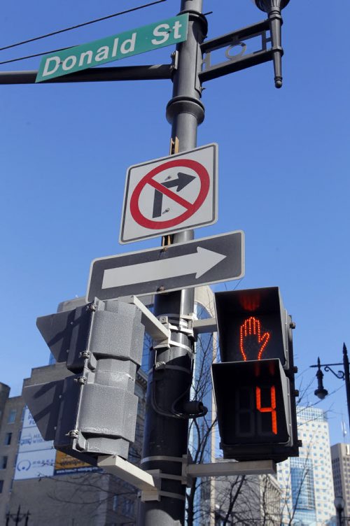 Timed pedestrian walk on Portage at Donald. Feb 19, 2013  BORIS MINKEVICH / WINNIPEG FREE PRESS