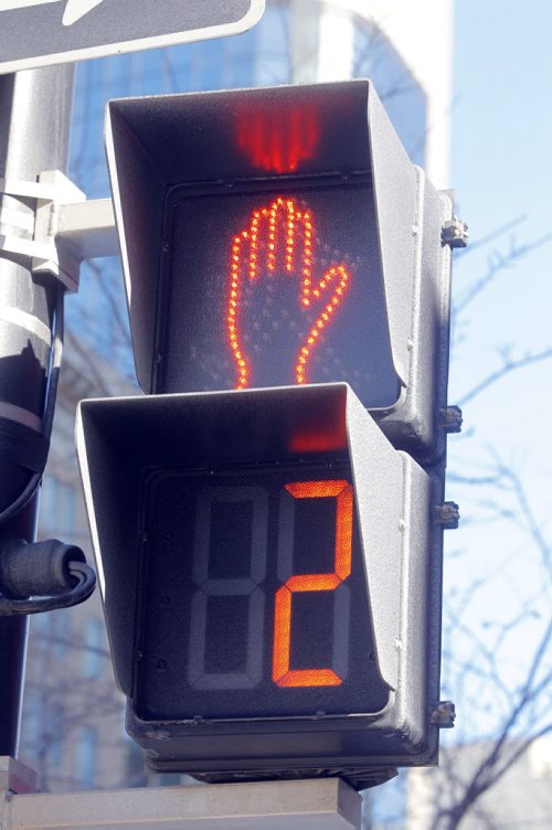 Timed pedestrian walk on Portage at Donald. Feb 19, 2013  BORIS MINKEVICH / WINNIPEG FREE PRESS