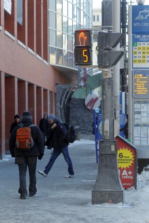 Timed pedestrian walk on Portage at Donald. Feb 19, 2013  BORIS MINKEVICH / WINNIPEG FREE PRESS