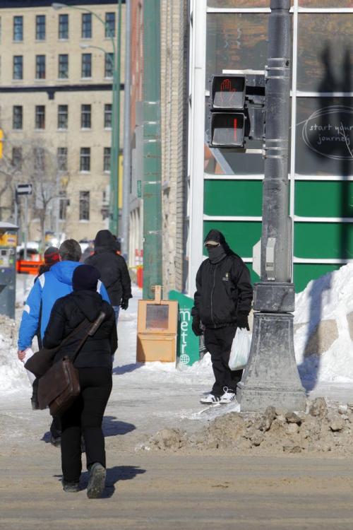 Timed pedestrian walk on Portage at Donald. Feb 19, 2013  BORIS MINKEVICH / WINNIPEG FREE PRESS