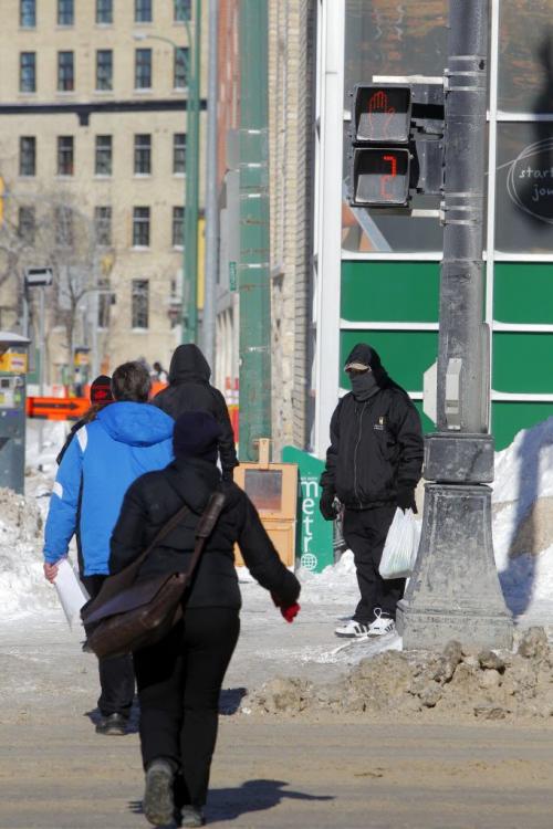 Timed pedestrian walk on Portage at Donald. Feb 19, 2013  BORIS MINKEVICH / WINNIPEG FREE PRESS