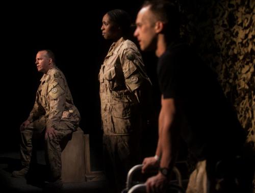 The Tarragon Theatre and Prairie Theatre Exchange joint production of This Is War. John Cleland as Sergeant Hughes (background) Lisa Berry as Master Corporal Tanya Young and Ian Lake as Private Jonny Henderson.  (Melissa Tait / Winnipeg Free Press)