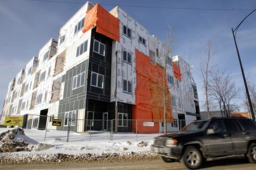 The H2O apartment complex under construction on the river side of Waterfront Drive. Phase I (43 units) is under construction and work on Phase II, also 43 units, will begin after Phase I is completed this spring or early summer. 130220 February 20, 2013 Mike Deal / Winnipeg Free Press