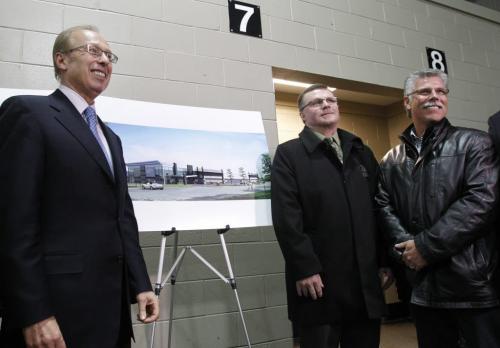 From left Mayor Sam Katz with Don Gale, past pres. and Bruce Talling, president, of the East End Community Club with the artist's rendition of the East End Arena Expansion Project at  517 Pandora Avenue East.    Jen Skerritt story (WAYNE GLOWACKI/WINNIPEG FREE PRESS) Feb. 21 2013