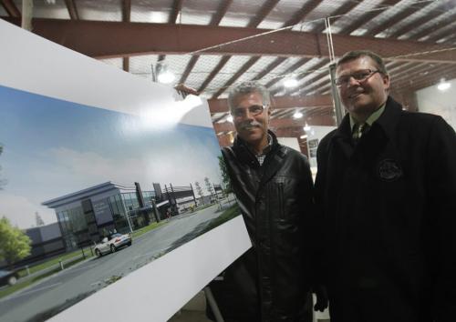 At left is Bruce Talling, president, and Don Gale, past pres. of the East End Community Club  with the artist's rendition of the East End Arena Expansion Project at  517 Pandora Avenue East.    Jen Skerritt story (WAYNE GLOWACKI/WINNIPEG FREE PRESS) Feb. 21 2013