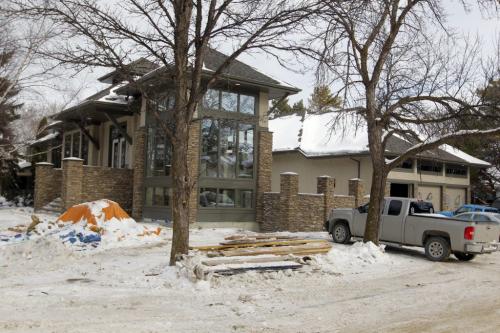The garage and HSC Lifestyles Lottery home, located in the city's Tuxedo neighbourhood, was vandalized with  spraypaint Wednesday night. Feb 21, 2013  BORIS MINKEVICH / WINNIPEG FREE PRESS