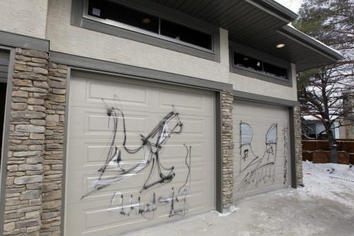 The garage and HSC Lifestyles Lottery home, located in the city's Tuxedo neighbourhood, was vandalized with  spraypaint Wednesday night. Feb 21, 2013  BORIS MINKEVICH / WINNIPEG FREE PRESS