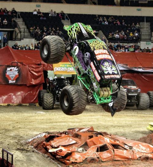 Driver Jon Zimmer pushes Grave Digger into flying over the cars during a competition at the Maple Leaf Monster Jam event at MTS Centre Saturday afternoon. 130223 February 23, 2013 Mike Deal / Winnipeg Free Press