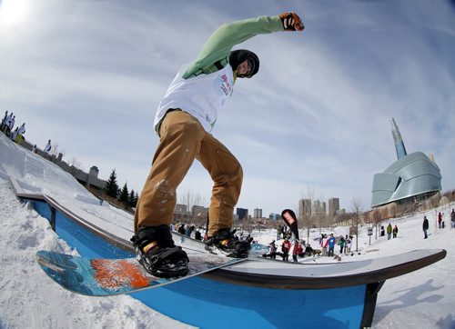 Jesse Walker, 22, from Oakbank, competes in the Snow Jam Snowboarding Competition at The Forks, Sunday, February 24, 2013. The Canadian Museum for Human Rights can be seen in the background. (TREVOR HAGAN/WINNIPEG FREE PRESS) CMHR