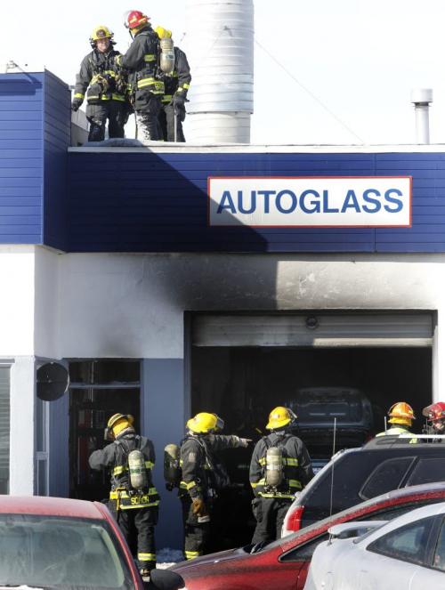 Winnipeg Fire Fighters at the scene of a fire that damaged the Artistic Autobody and Glass business at 200 Watt St. at Levis St. Monday. A section of Watt. St. closed to traffic.   (Wayne Glowacki/ Winnipeg Free Press) Feb.25 2013