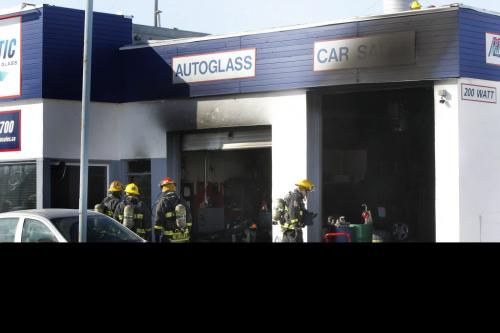 Winnipeg Fire Fighters at the scene of a fire that damaged the Artistic Autobody and Glass business at 200 Watt St. at Levis St. Monday. A section of Watt. St. closed to traffic.   (Wayne Glowacki/ Winnipeg Free Press) Feb.25 2013