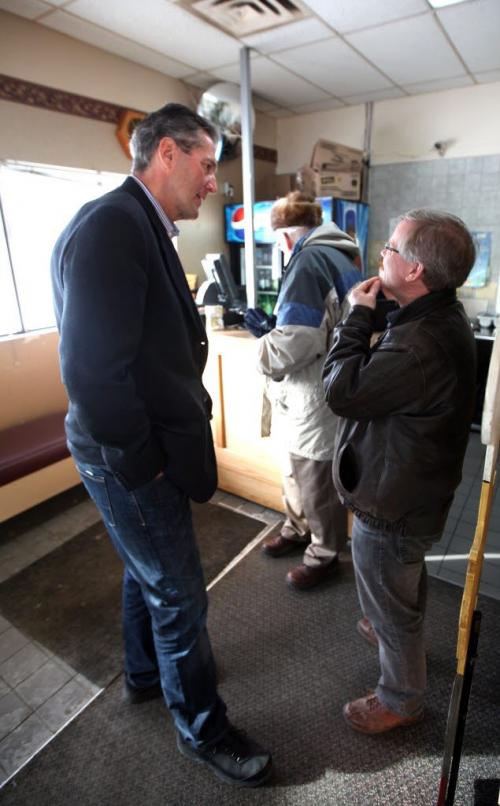 Brian Pallister, towering over his constituent takes time to listen to an opinion. The former MP and now Provincial Conservative Party Leader is the subject of a Randy Turner tale.  Feb 22, 2013 - (Phil Hossack / Winnipeg Free Press)