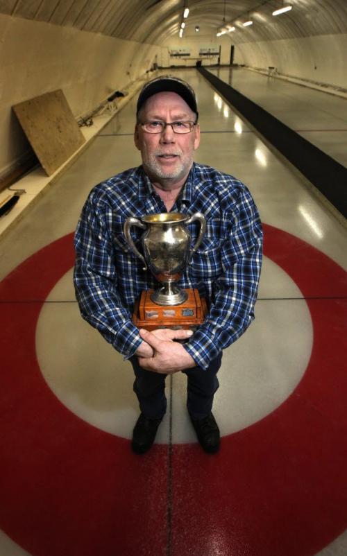 Clanwilliam resident and icemaker Jim Richards holds on to the hundred year old "Hugh McPherson Cup", a prized trophy that's been at the Clanwilliam Club as long as there's been a club. See Randy Turner's story. Feb 21, 2013 - (Phil Hossack / Winnipeg Free Press)