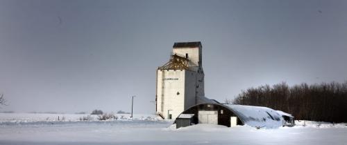 A hundred "plus" years old, the Clanwilliam's two sheet rink sits nearly buried in snow along side an abandoned rail line and Elevator. See Randy Turner's story. Feb 21, 2013 - (Phil Hossack / Winnipeg Free Press)