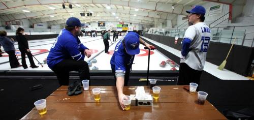 Honoring another rural bonspiel ritual, Carberry's Mike Reykdal, Scott Witherspoon and Warren Birch quench their thirst with the social lubricant of choice at the community bonspiel. Featuring over a hundred teams, the spiel is a success story in the rural curling world. Feb 21, 2013 - (Phil Hossack / Winnipeg Free Press)