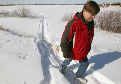 Craig Henderson and other citizens are in opposition to proposed housing development in South St Clements He walks in field where homes are to be built-See Bill Redekop story- February 26, 2013   (JOE BRYKSA / WINNIPEG FREE PRESS)