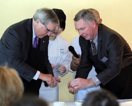 Dr. Lloyd Axworthy, president and vice-chancellor at UWinnipeg,  and Winnipeg Technical College president John Bobbette make some chinese dumplings at a news conference. The program, named Restaurant and Food Services Entrepreneurship Diploma, was announced today at the Assiniboine Park Conservatory. It combines Winnipeg Technical Colleges Culinary Arts & Design Program and the Business and Economics Bachelor of Business Administration program at The University of Winnipeg. Student chef Yin Niu and instructor Louis Rodriguez in behind middle. Feb 26, 2013  BORIS MINKEVICH / WINNIPEG FREE PRESS
