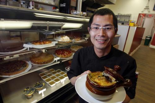 Restaurant review Cafe Ce Soir at 937 Portage Ave. Owner/Pastry Chef Cam Tran poses with some french onion soup in front of the desert cooler display. Feb 26, 2013  BORIS MINKEVICH / WINNIPEG FREE PRESS