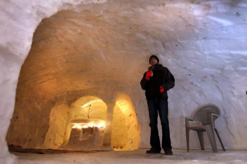 Evan Jameson, 26, and 20 of his buddies and cousins built a massive three room "Quinzloo" (quinzee/igloo) in the backyard of his parents St. Vital home.  It is big enough for  40 people to party and even has an outdoor patio. Kevin Rollason story (WAYNE GLOWACKI/ WINNIPEG FREE PRESS) WINNIPEG FREE PRESS  Feb.27 2013
