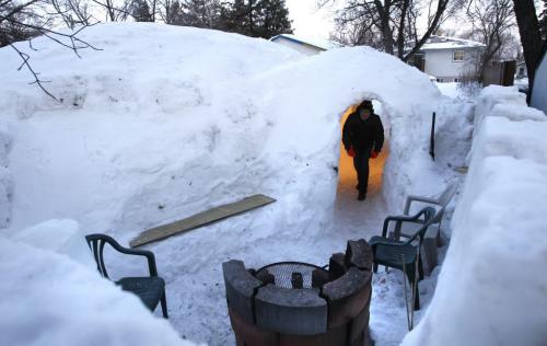 Evan Jameson, 26, and 20 of his buddies and cousins  built a massive three room "Quinzloo" (quinzee/igloo) in the backyard of his parents St. Vital home.  It is big enough for  40 people to party and even has an outdoor patio. Kevin Rollason story (WAYNE GLOWACKI/ WINNIPEG FREE PRESS) WINNIPEG FREE PRESS  Feb.27 2013
