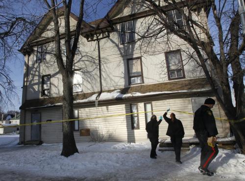 Winnipeg Police at the scene Wednesday where man was found dead in a suite in a rooming house on Balmoral Street on Tuesday. Aldo Santin story (WAYNE GLOWACKI/ WINNIPEG FREE PRESS) WINNIPEG FREE PRESS  Feb.27 2013