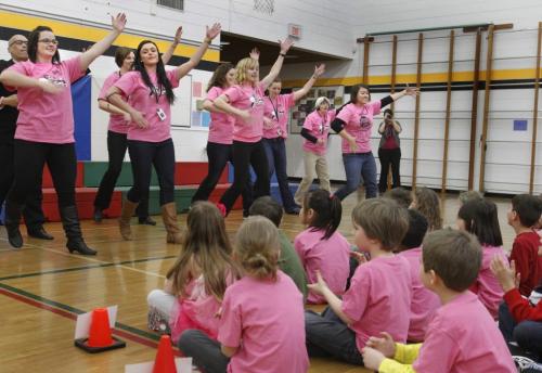 Teachers at Hastings School surprised students with a "flash mob" dance performance at the schools'  Pink Shirt Day assembly Wednesday to raise awareness against bullying. The event also included student produced anti-bullying videos and a cheque presentation by a Grade 3/4 class that held a fundraiser for the Tourette's Syndrome Foundation of Canada and CancerCare Manitoba.  (WAYNE GLOWACKI/ WINNIPEG FREE PRESS) WINNIPEG FREE PRESS  Feb.27 2013