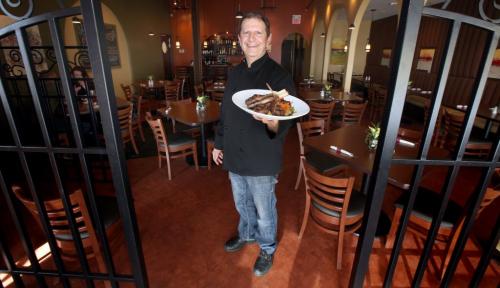 Steve Kandalakis shows off a plate of Lamb Chops at the "Iconic" Steve's Bistro February 27, 2013 - (Phil Hossack / Winnipeg Free Press)