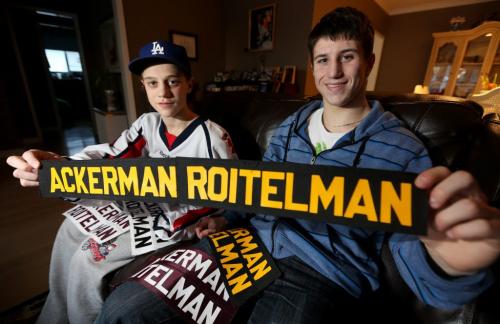 Brothers, Dustin, 14, and Evan Ackerman-Roitelman, 18, with some of their hockey name badges, Friday, March 1, 2013. (TREVOR HAGAN/WINNIPEG FREE PRESS) carolin vesely story