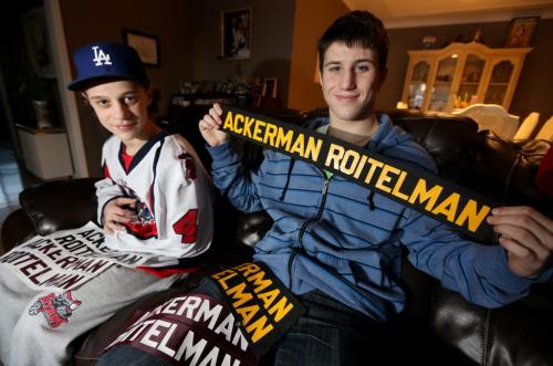 Brothers, Dustin, 14, and Evan Ackerman-Roitelman, 18, with some of their hockey name badges, Friday, March 1, 2013. (TREVOR HAGAN/WINNIPEG FREE PRESS) carolin vesely story