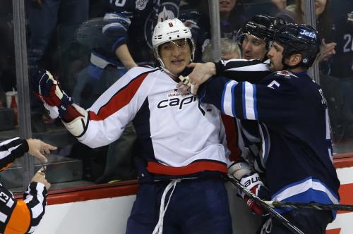 Washington Capitals' Alex Ovechkin (8) gets Winnipeg Jets' Mark Stuart (5) to take a penalty during the third period of NHL hockey action at MTS Centre, Saturday, March 2, 2013. (TREVOR HAGAN/WINNIPEG FREE PRESS)