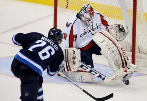 Winnipeg Jets' Blake Wheeler (26) is stopped by Washington Capitals' goaltender Braden Holtby (70) during a good scoring chance in the third period of NHL hockey action at MTS Centre, Saturday, March 2, 2013. (TREVOR HAGAN/WINNIPEG FREE PRESS)