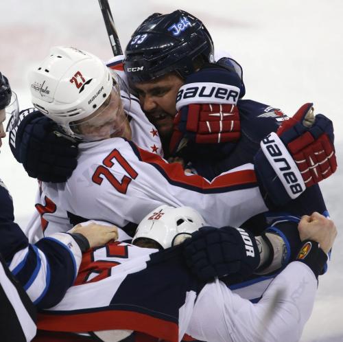 Washington Capitals' Karl Alzner (27) and Winnipeg Jets' Dustin Byfuglien (33) get in each others faces during the third period of NHL hockey action at MTS Centre, Saturday, March 2, 2013. (TREVOR HAGAN/WINNIPEG FREE PRESS)
