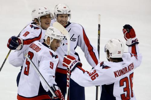 Washington Capitals' Alex Ovechkin (8), Mike Ribeiro (9), Eric Fehr (16), and Tomas Kundratek (36) celebrate after Ribeiro scored during third period NHL hockey action against the Winnipeg Jets' at MTS Centre, Saturday, March 2, 2013. (TREVOR HAGAN/WINNIPEG FREE PRESS)