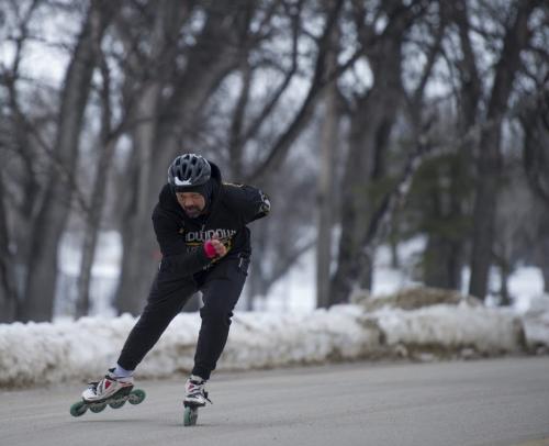030213 Winnipeg-   Cliff Sumter trains for competitive inline skating by skating 26.2 miles (a marathon) at Kildonan Park Saturday afternoon. He says the cold weather makes for slower training times as the bearings in the skates are a little stickier. DAVID LIPNOWSKI / WINNIPEG FREE PRESS