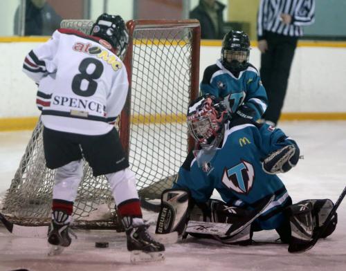 Goaltender, Cole Davies, from the Tuxedo 9 A3 Lightning, stops Ryan Spence of the Tyndall Park Thunder at River Heights Community Centre, during playoff action, Sunday, March 3, 2013. (TREVOR HAGAN/WINNIPEG FREE PRESS)