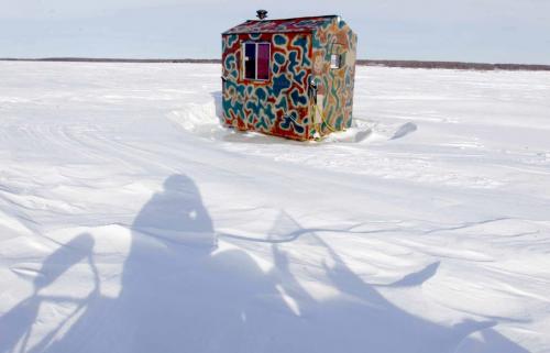 ICE SHACK PROJECT- These ice fishing huts are located in Balsam Bay on Lake Winnipeg. Shadow of the photographer in foreground. Feb 20, 2013  BORIS MINKEVICH / WINNIPEG FREE PRESS