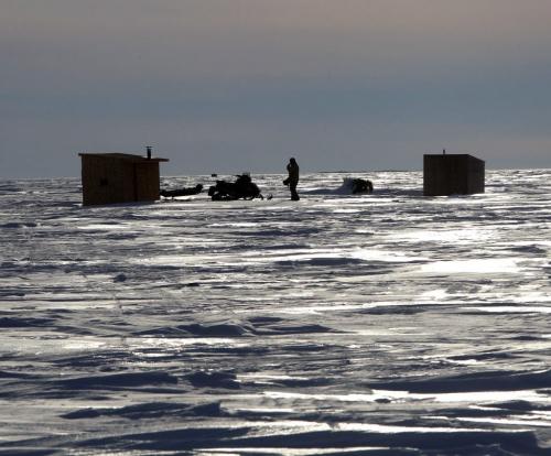 A lone ice fisherman is backlit on Lake Winnipeg south of Grand Beach, Manitoba. Feb 20, 2013  BORIS MINKEVICH / WINNIPEG FREE PRESS